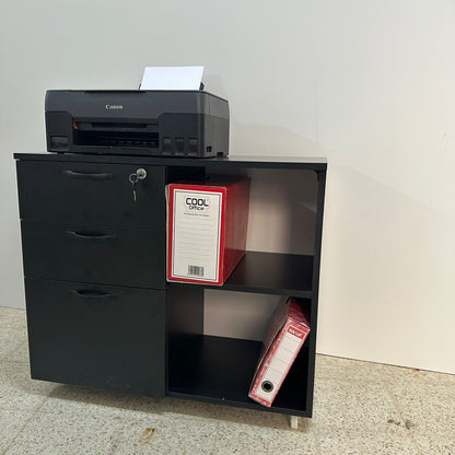 Meuble rangement bureau noir – vue de côté avec imprimante Canon et classeurs rouges