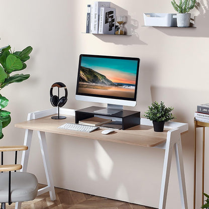 Rehausseur écran noir en situation bureau – vue d'ensemble avec moniteur iMac, casque audio et plantes