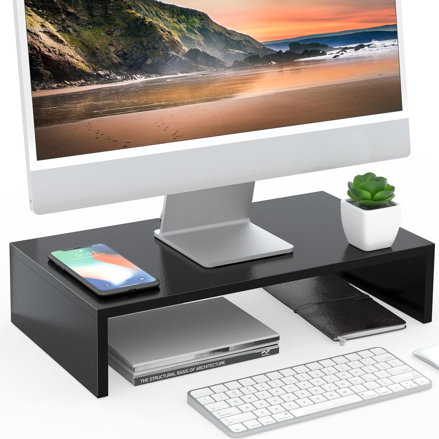 Rehausseur écran noir en situation bureau – moniteur iMac, casque audio et plante verte