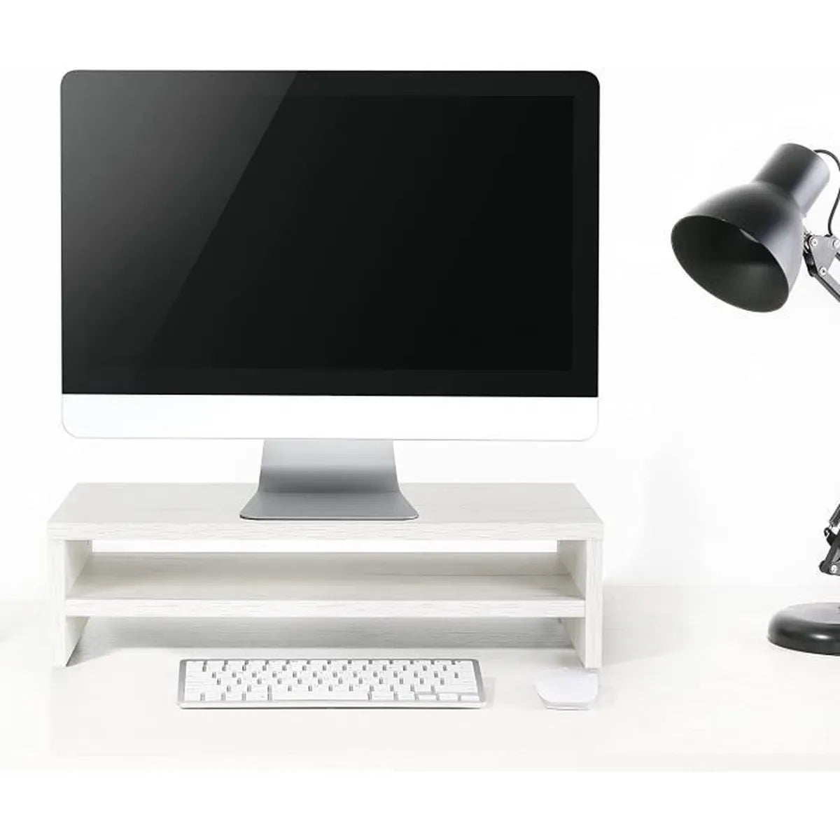 Rehausseur écran noir en situation bureau – moniteur iMac, plante et clavier